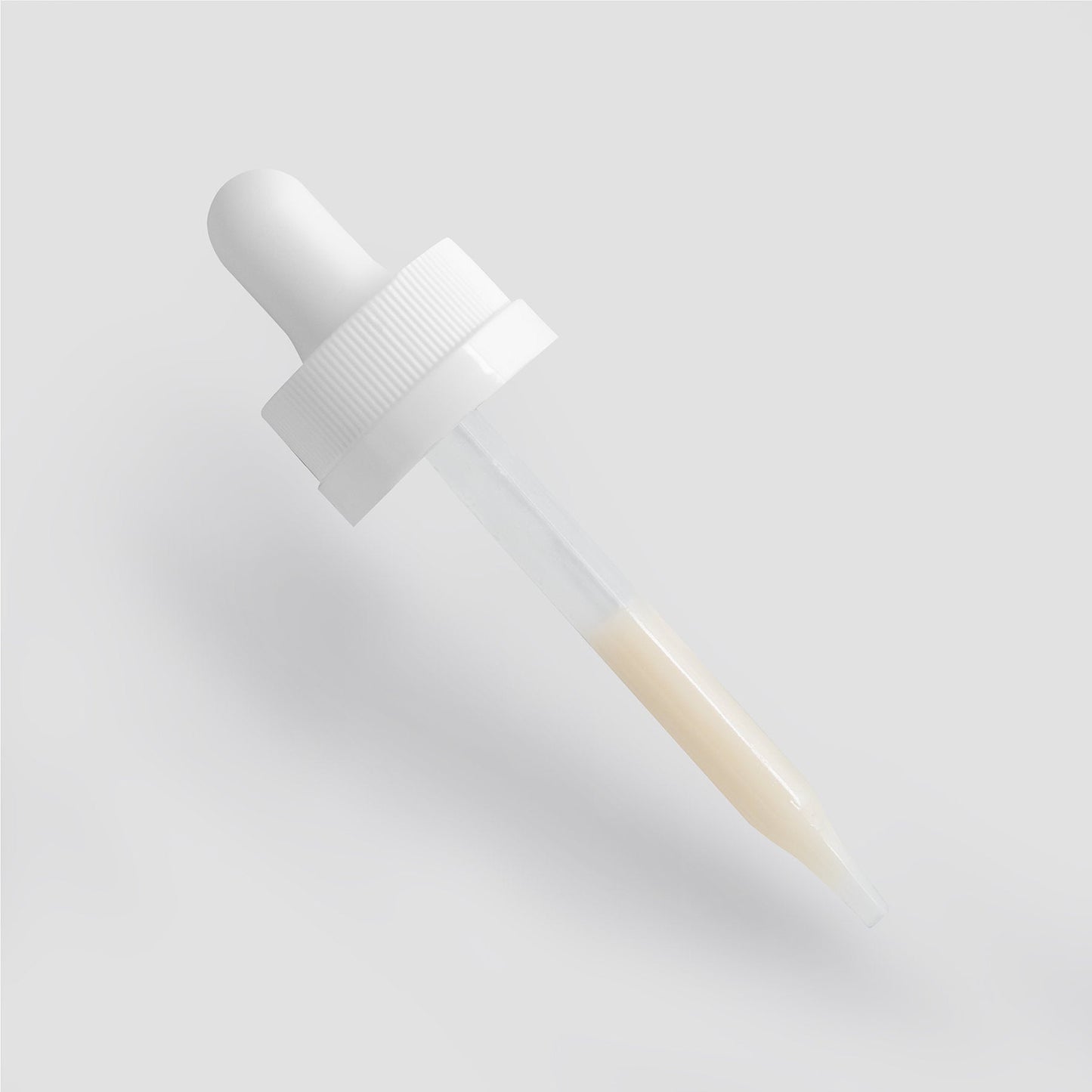 Dark Spot Serum dropper with beige liquid for even skin tone.