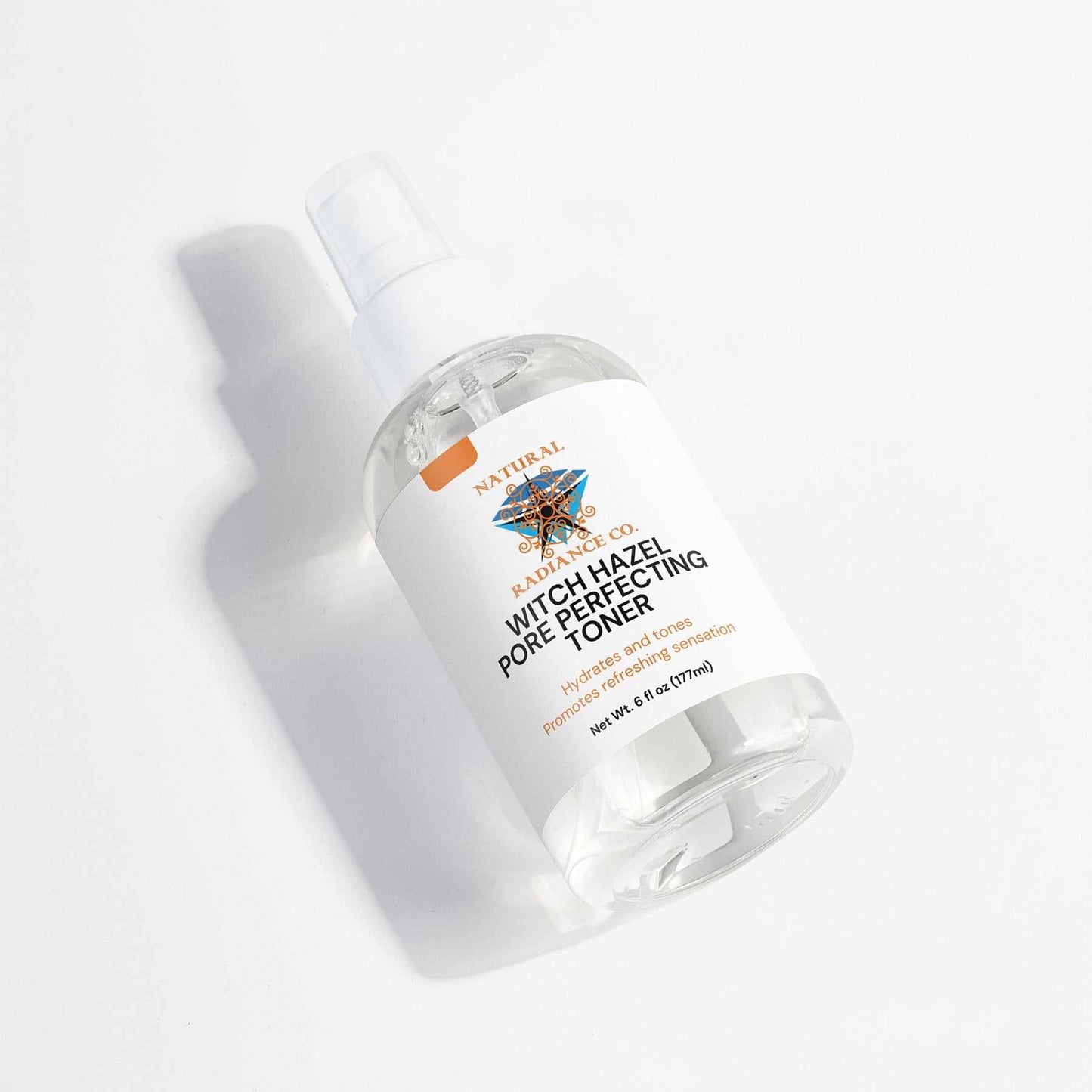 Witch Hazel Pore Perfecting Toner in a spray bottle with label, 6 fl oz.