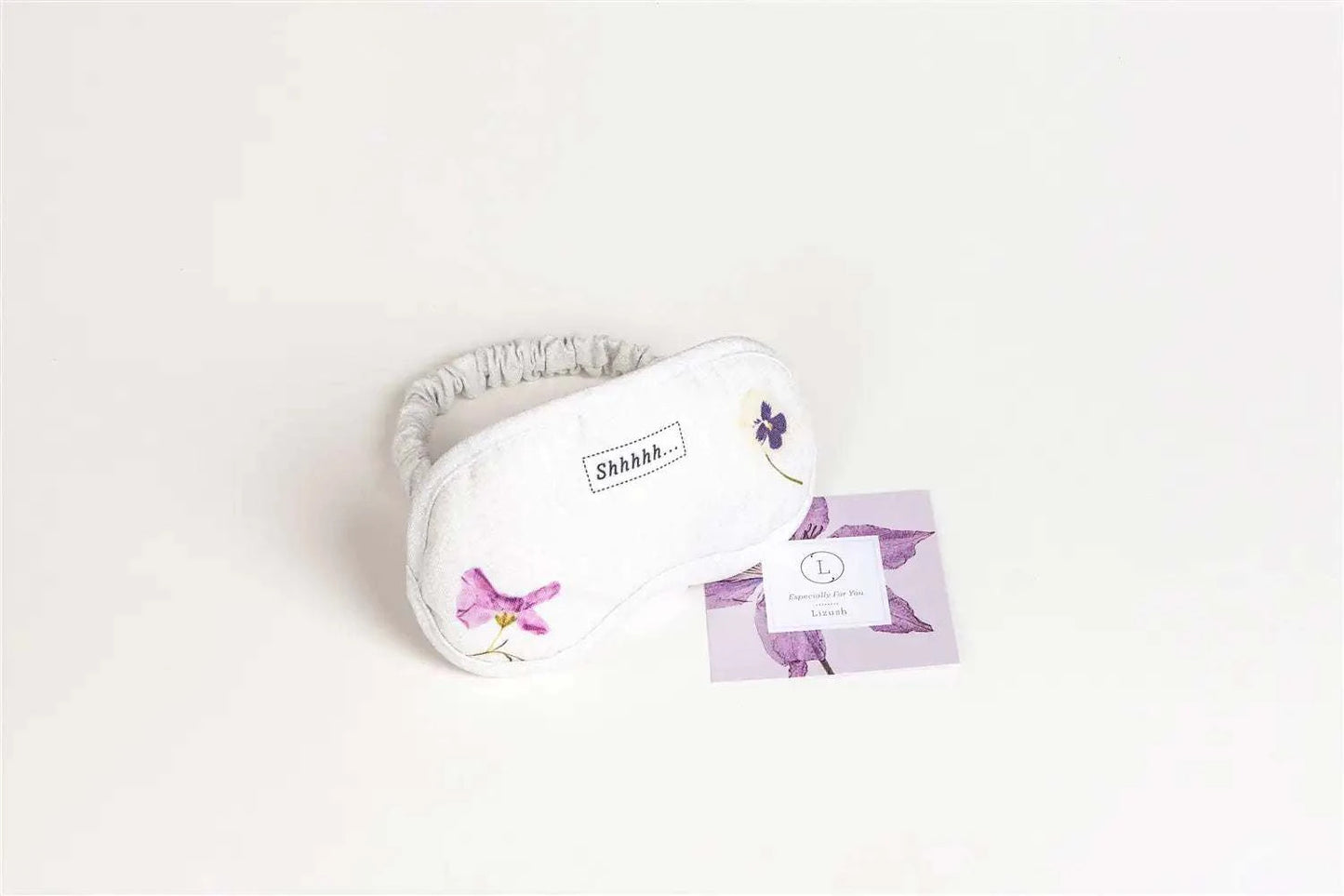 Floral eye mask and greeting card from Lavender Body Gift Set, perfect for travel toiletry kit and appreciation gift.