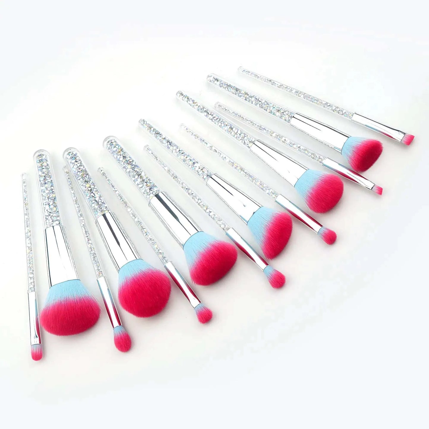 Frost Candy Vegan Brushes with pink and blue bristles arranged in a row on a white background.