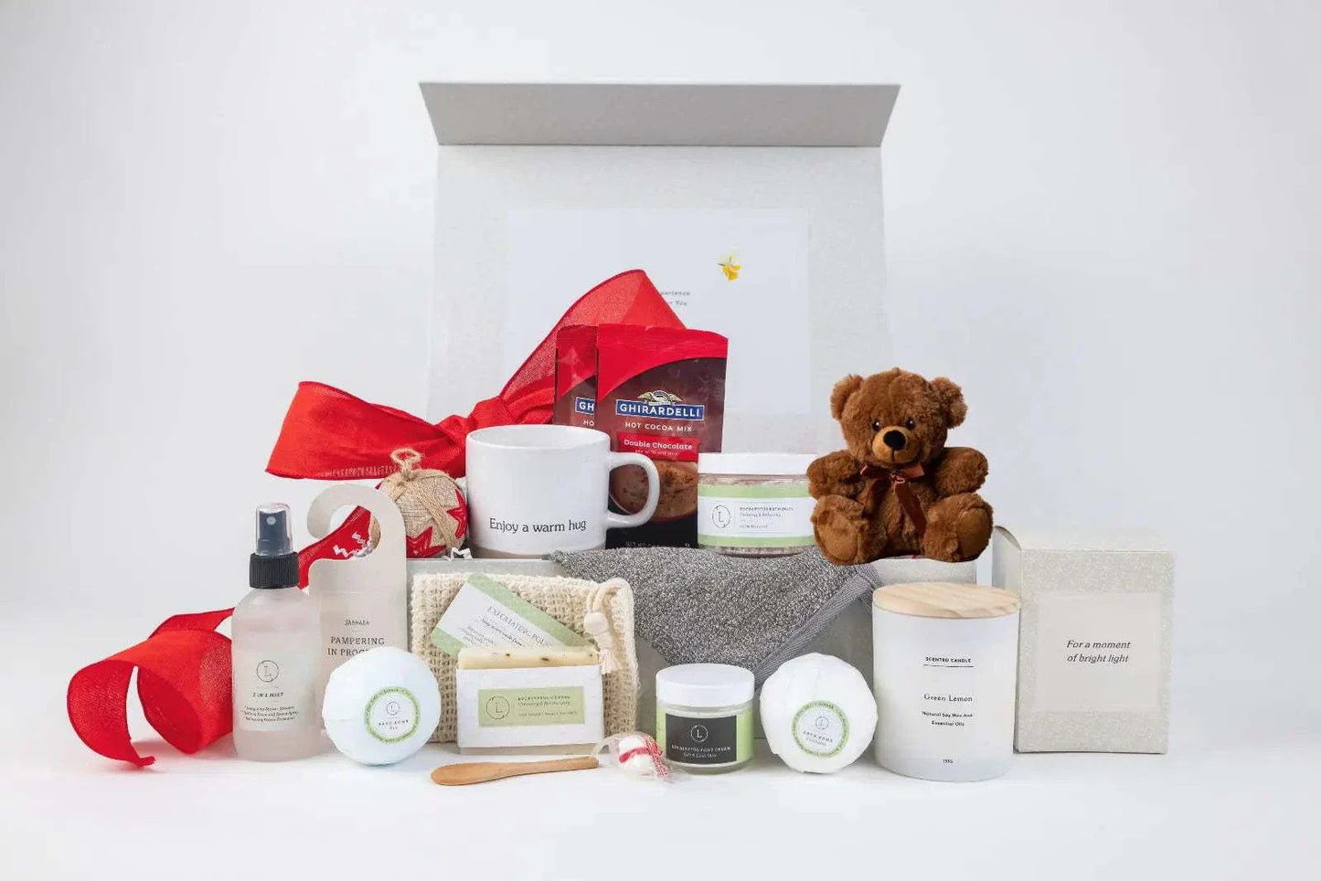 Valentine's Day luxury spa gift set with ceramics, skincare, candles, and teddy bear.