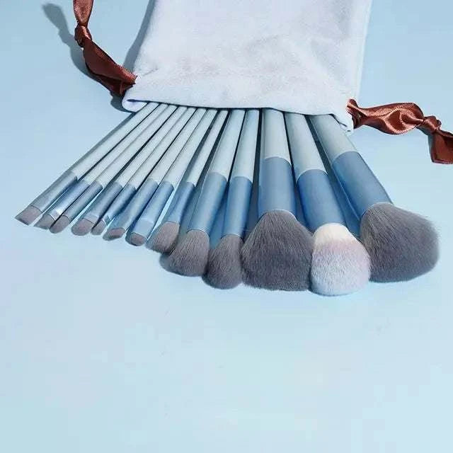 Soft fluffy makeup brushes set displayed in a stylish arrangement with a storage pouch.