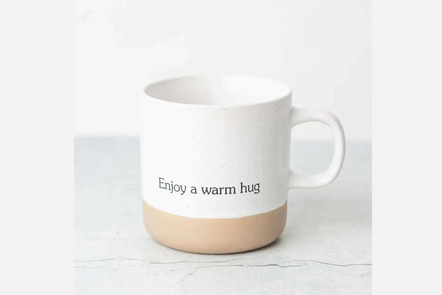 Valentine's Day gift luxury spa set with ceramic mug and "Enjoy a warm hug" text.