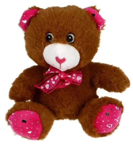 Cute teddy bear with pink heart accents, part of Valentine's Day luxury spa gift set.