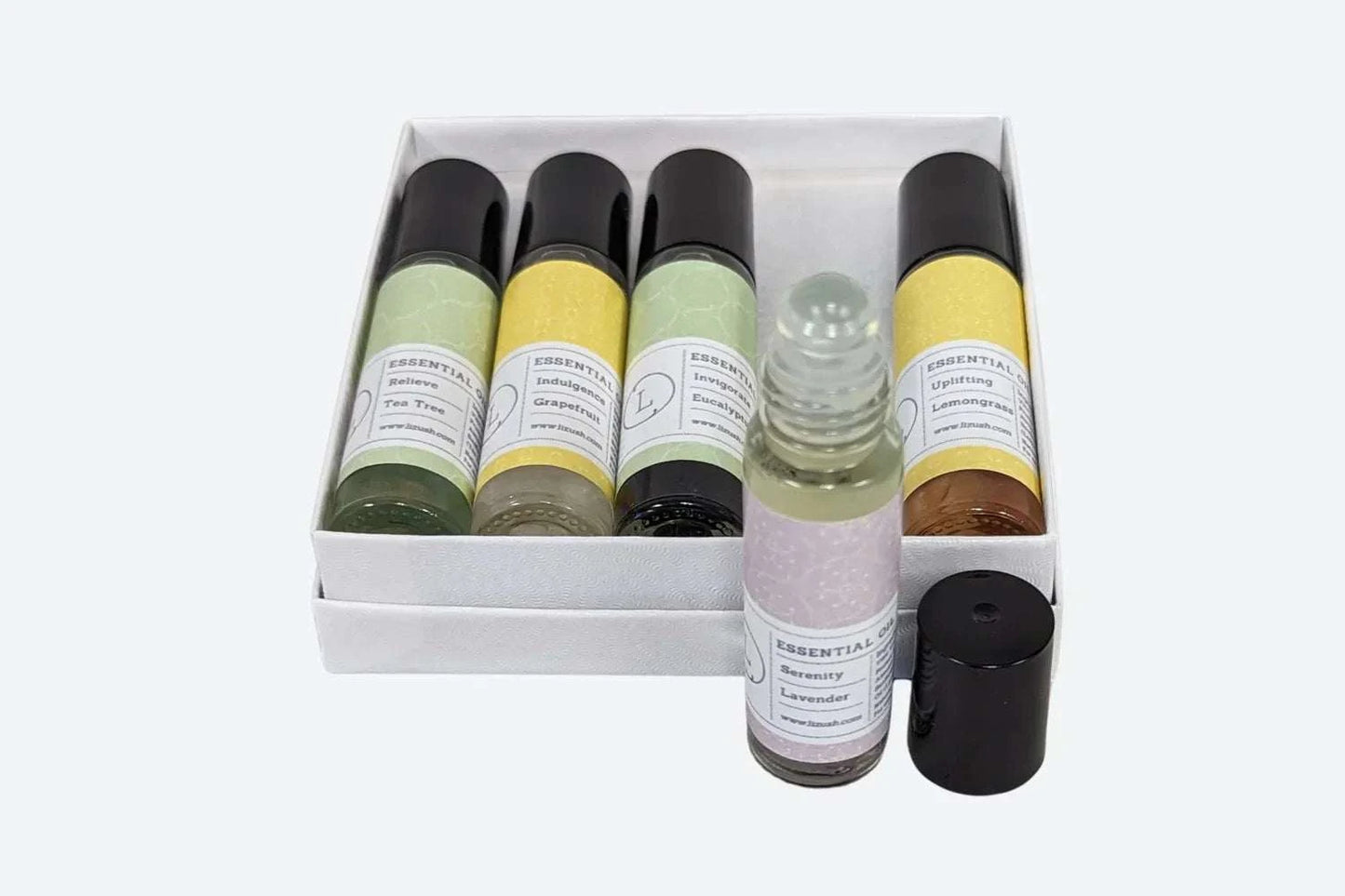 Essential Oils Roll-On Set with Crystals and CBD in white gift box.