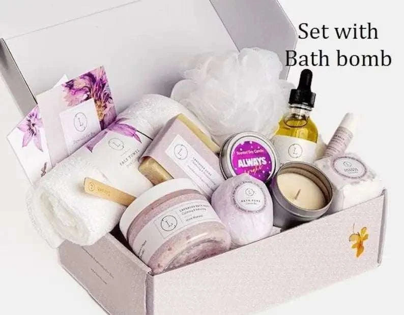 All natural lavender gift box with bath bomb, shower steamer, soap, body oil, facial mask, lip balm, candle, and accessories.