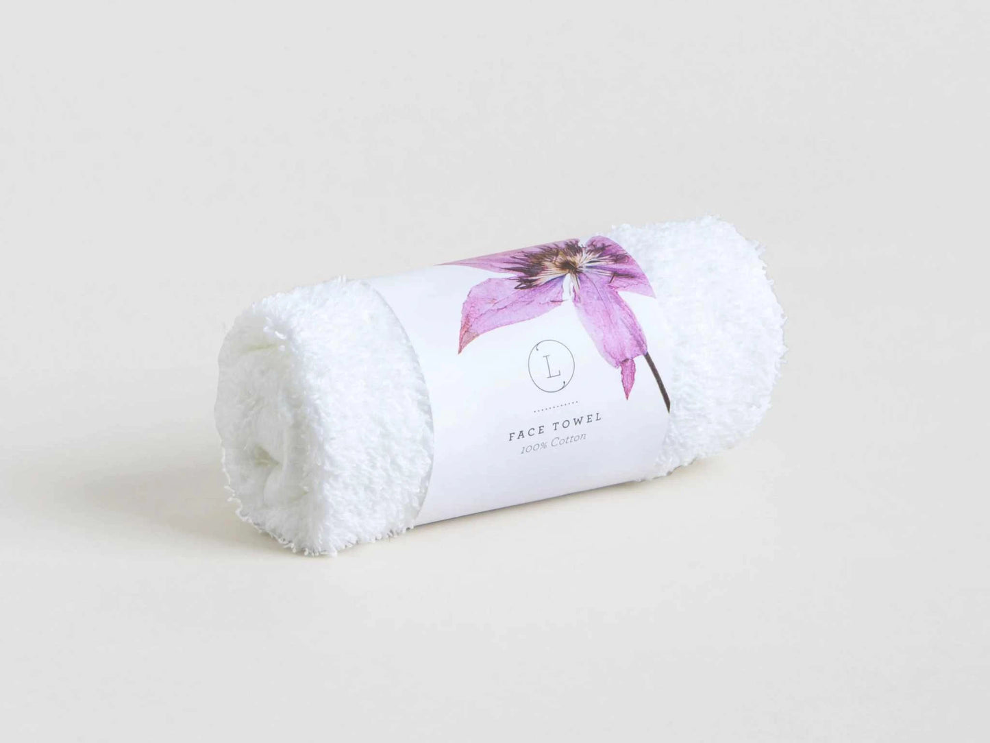 White face towel rolled with floral packaging, part of the Breast Cancer Awareness Gift Box.