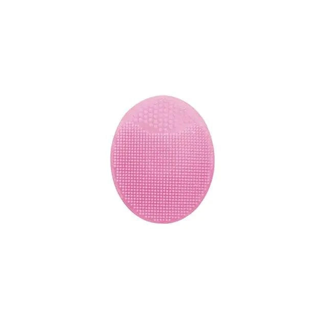 Pink silicone facial exfoliating cleansing brush with soft, flexible bristles for deep skincare.
