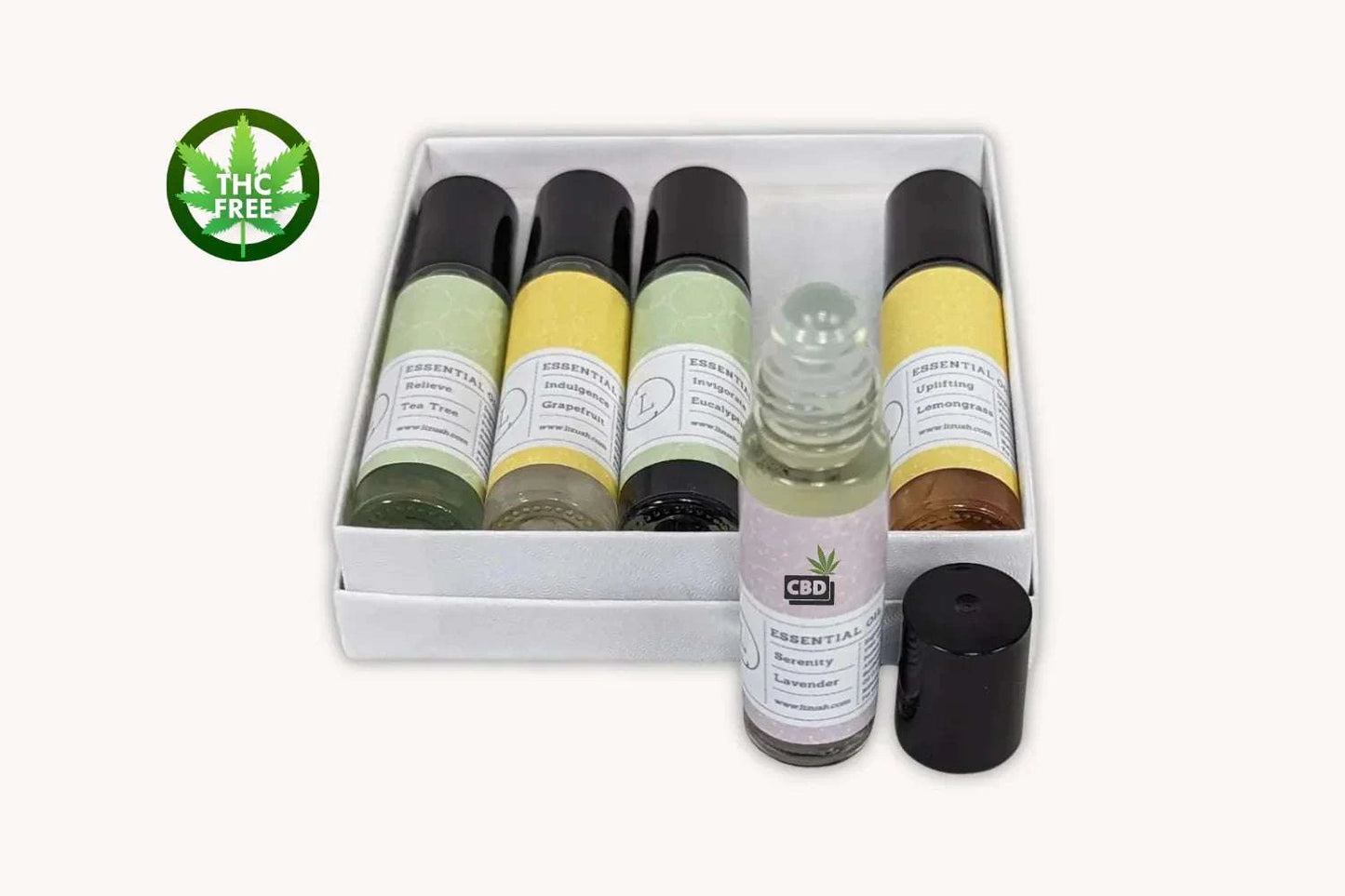 Essential Oils Roll-On Set with Crystals, CBD, and THC Free label, featuring lavender, eucalyptus, lemongrass, tea tree, and grapefruit scents in a white gift box.