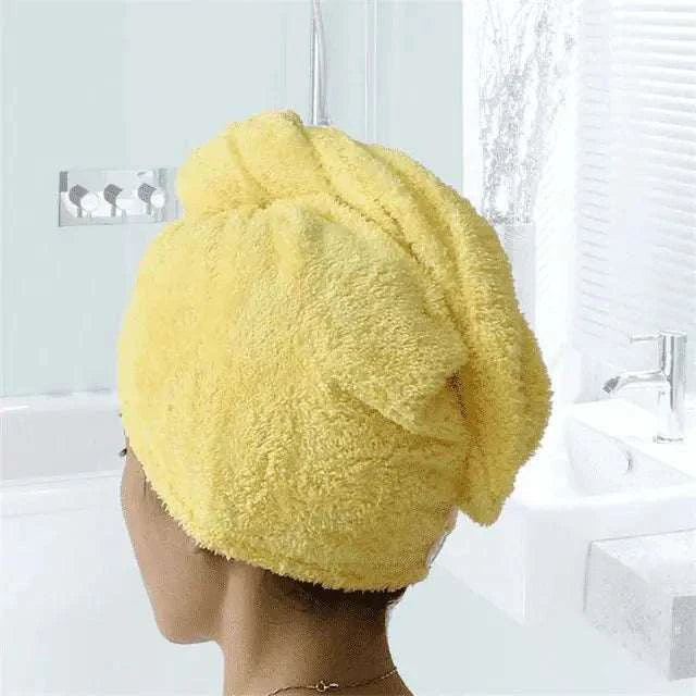 Magic Hair Towel wrapped on head, showcasing its quick-drying microfiber material in a bathroom setting.
