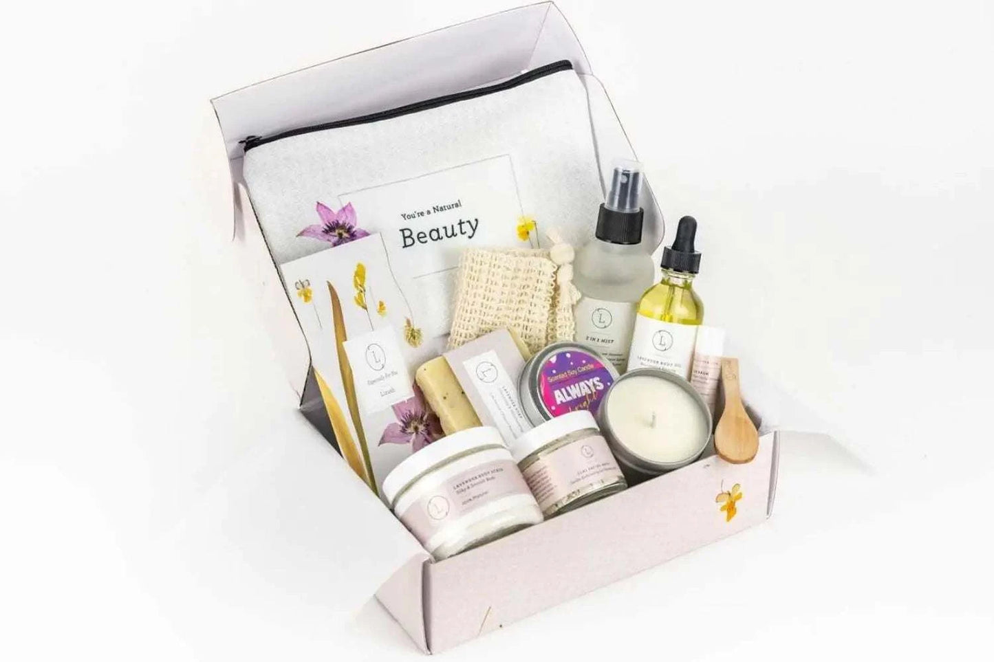 Spa Gift Box with natural lavender bath and body products, including soap, body scrub, body oil, facial mask, and a scented candle in a decorative package.