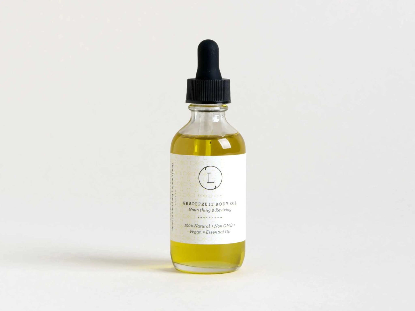 Grapefruit body oil in a dropper bottle, part of the Christmas gift box spa set.