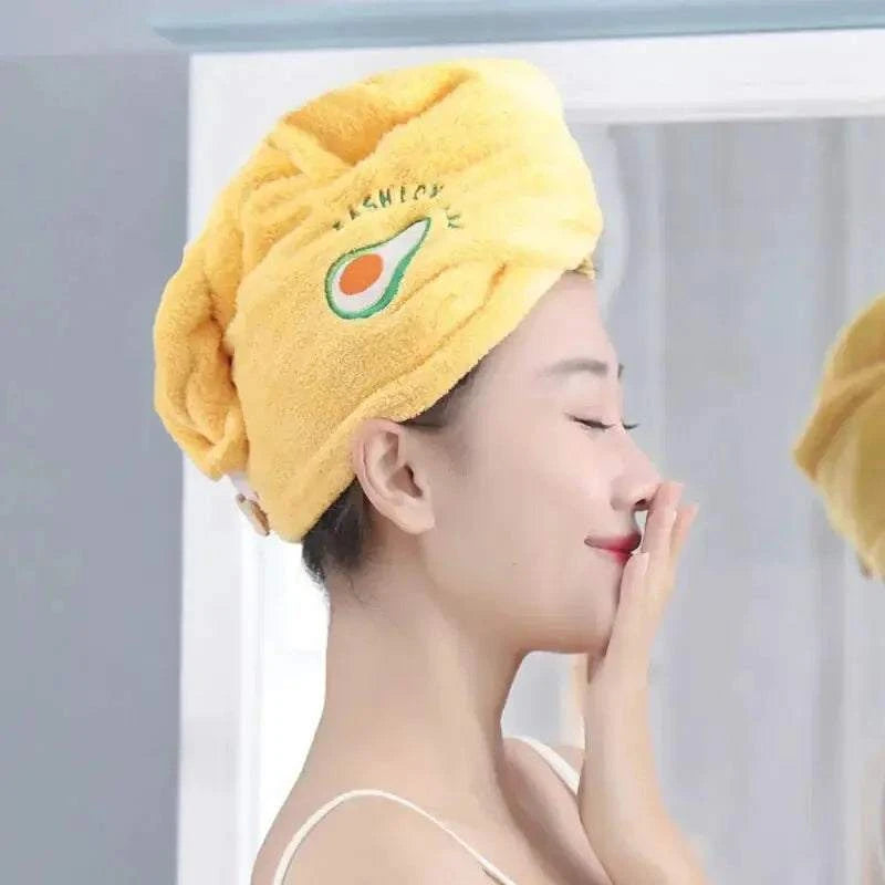 Woman using Magic Hair Towel for quick drying.