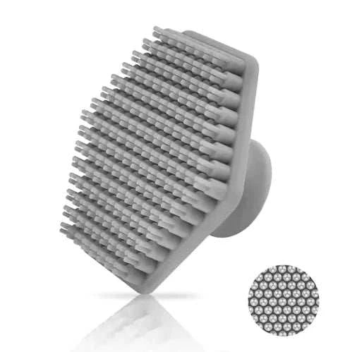 Miniature silicone facial cleaning brush with soft bristles for deep cleansing and exfoliation.