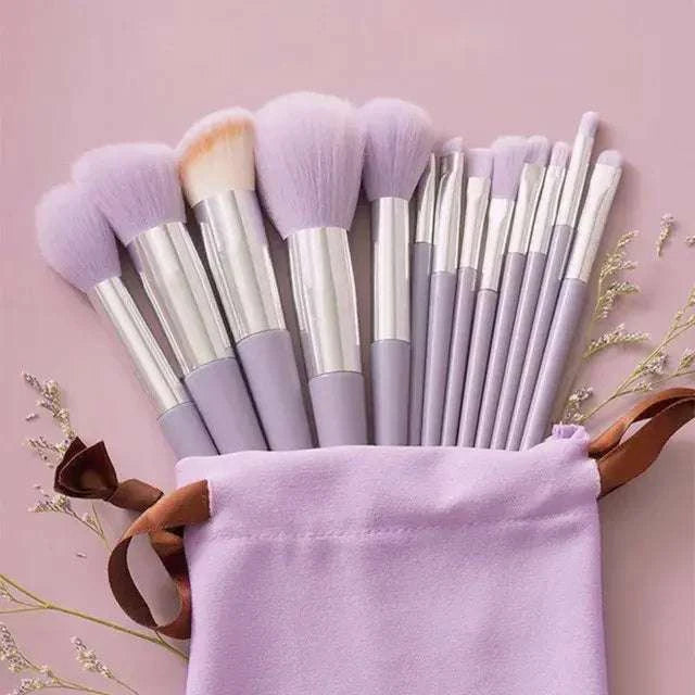 Soft fluffy makeup brushes set in a pastel pouch for luxurious application.