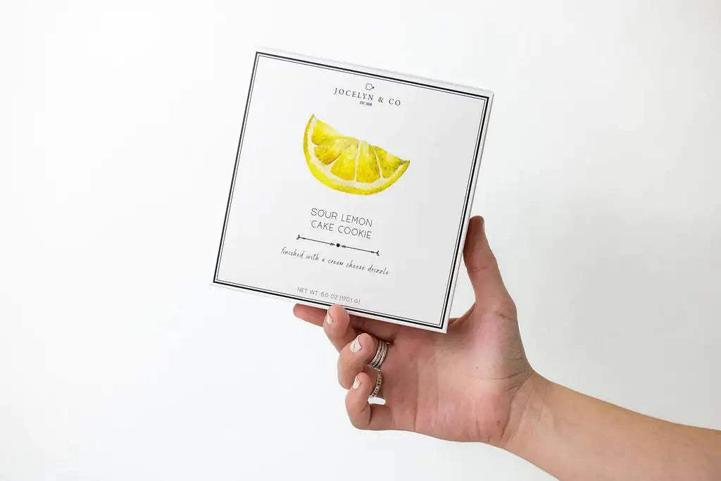 Natural care package featuring a get well gift basket with a lemon-themed cookie box.