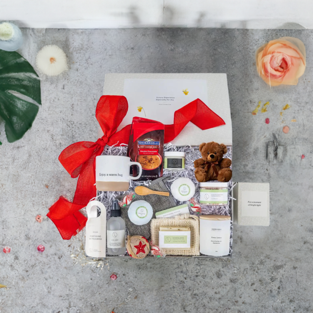 Valentine's Day luxury spa gift set with natural skincare, candle, candies, and a teddy bear in a beautifully wrapped box.