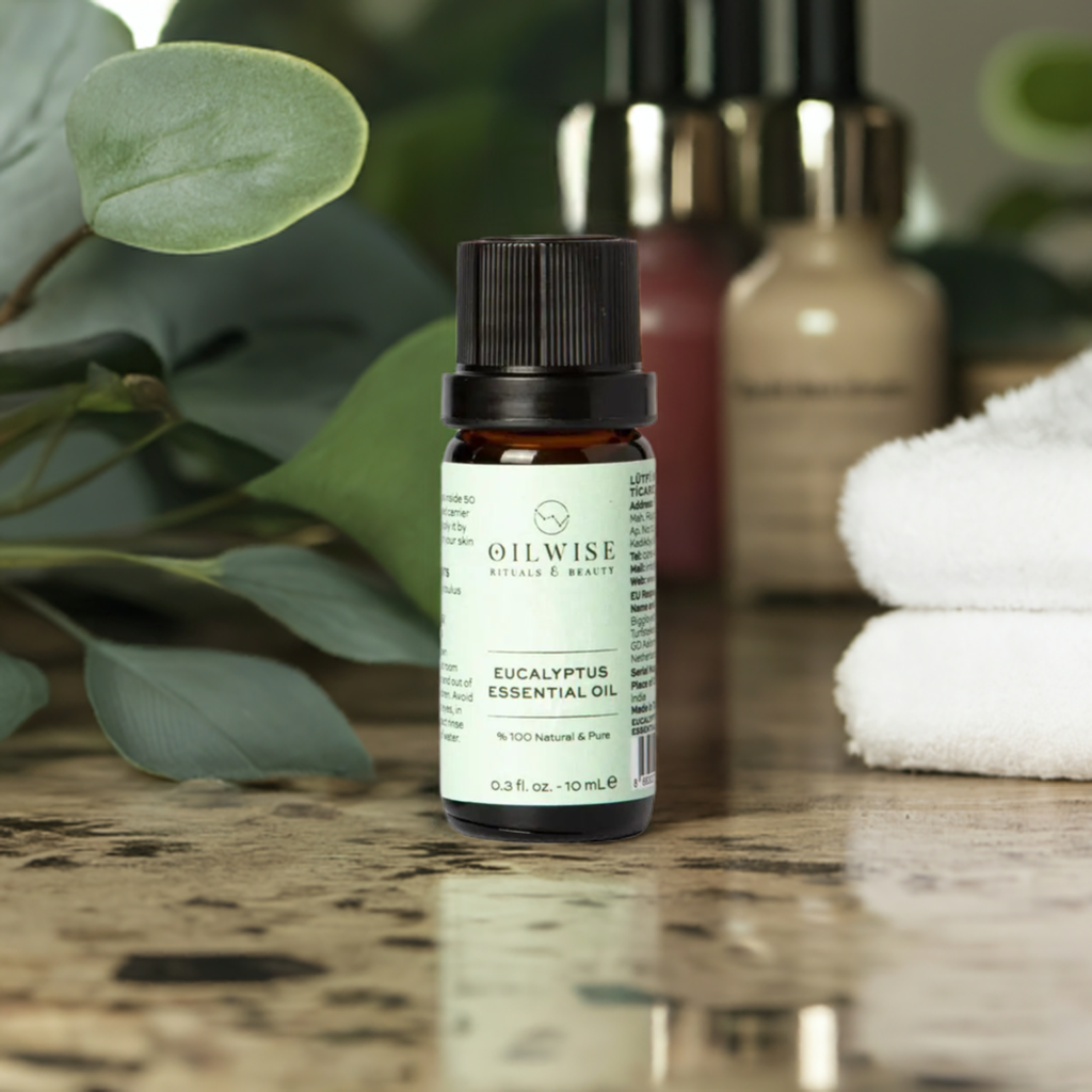 Oilwise Eucalyptus Essential Oil bottle on a table with a natural background.