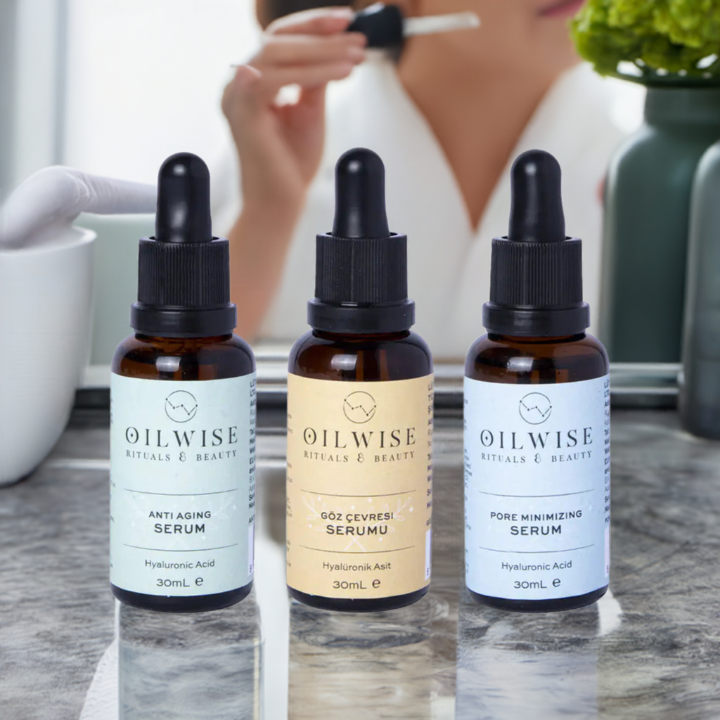 Oilwise Antiaging Serum & Pore Minimizing Serum & Eye Repair Serum Set on a vanity table with skincare ingredients in the background.