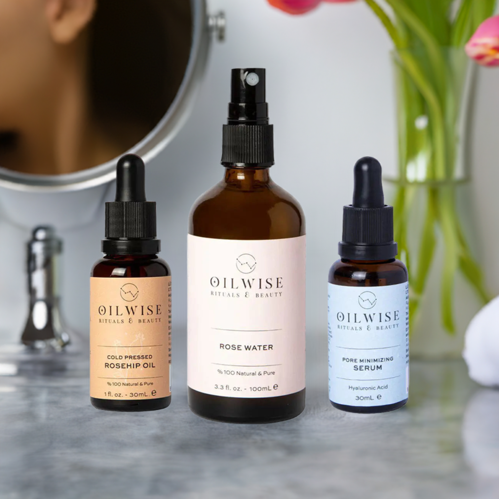 Oilwise Anti-Blemish Moisturizing Kit with rosehip seed oil, rose water, and pore minimizing serum displayed on a vanity.