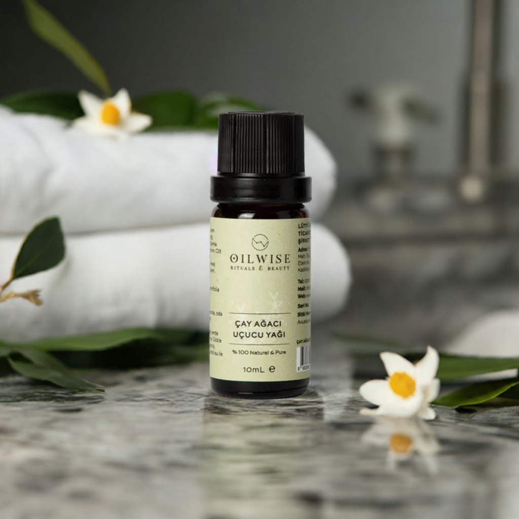 Oilwise Tea Tree Oil bottle, 10 ml, with antibacterial properties for acne-prone skin, on a marble surface.
