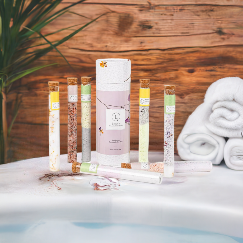 Luxurious bath salts and bombs gift set in 7 glass tubes, displayed elegantly by a bathtub.