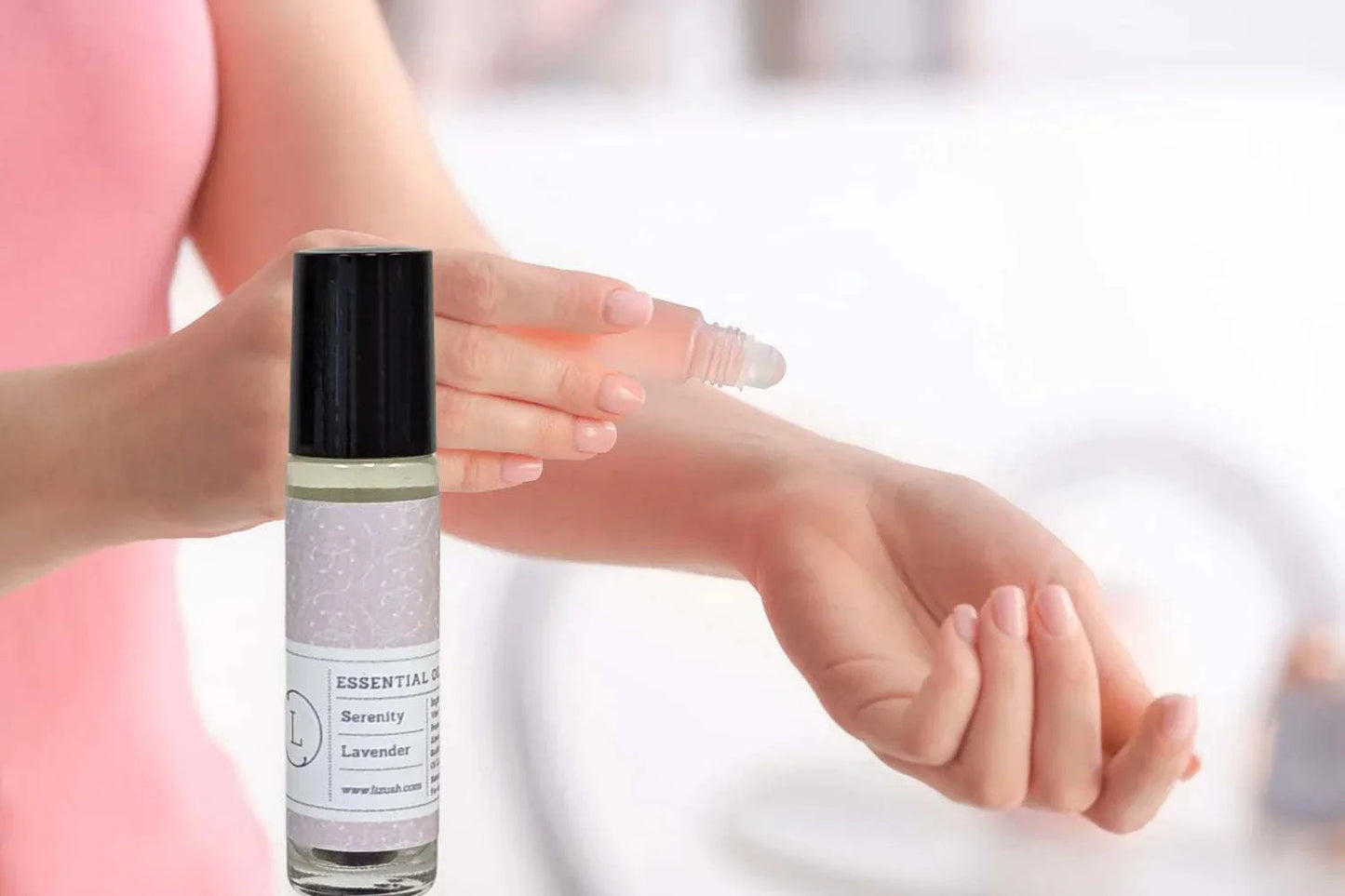 Essential Oils Roll-On Set with Crystals and CBD application on wrist.