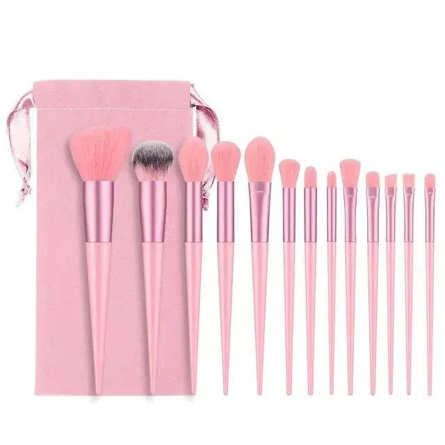 Soft fluffy makeup brushes set with pink handles and matching pouch for flawless application.