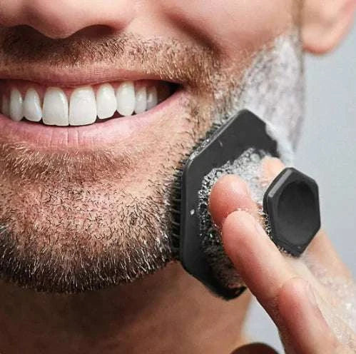 Miniature silicone facial cleaning brush used for exfoliation and deep cleansing on facial hair.