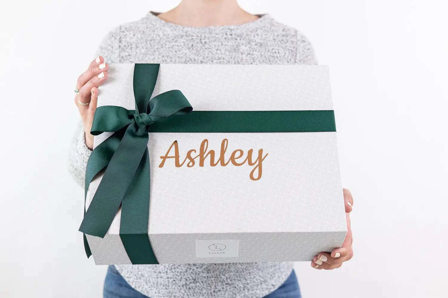 Celebration gift box with green ribbon, customizable name, perfect for congratulatory occasions.
