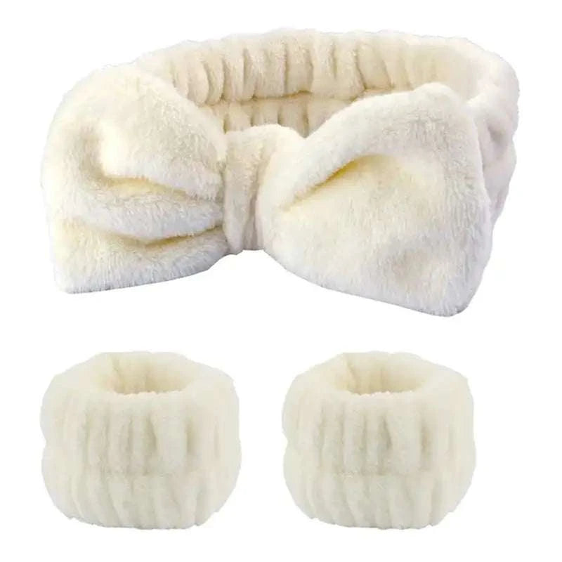 Plush bow hair and wristband set in soft fleece, ideal for skincare routines.