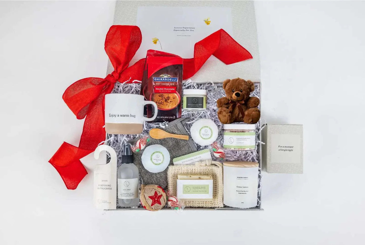 Valentine's Day luxury spa gift set with ceramic mug, scented candle, bath products, teddy bear, and candies, perfect for showing love and appreciation.