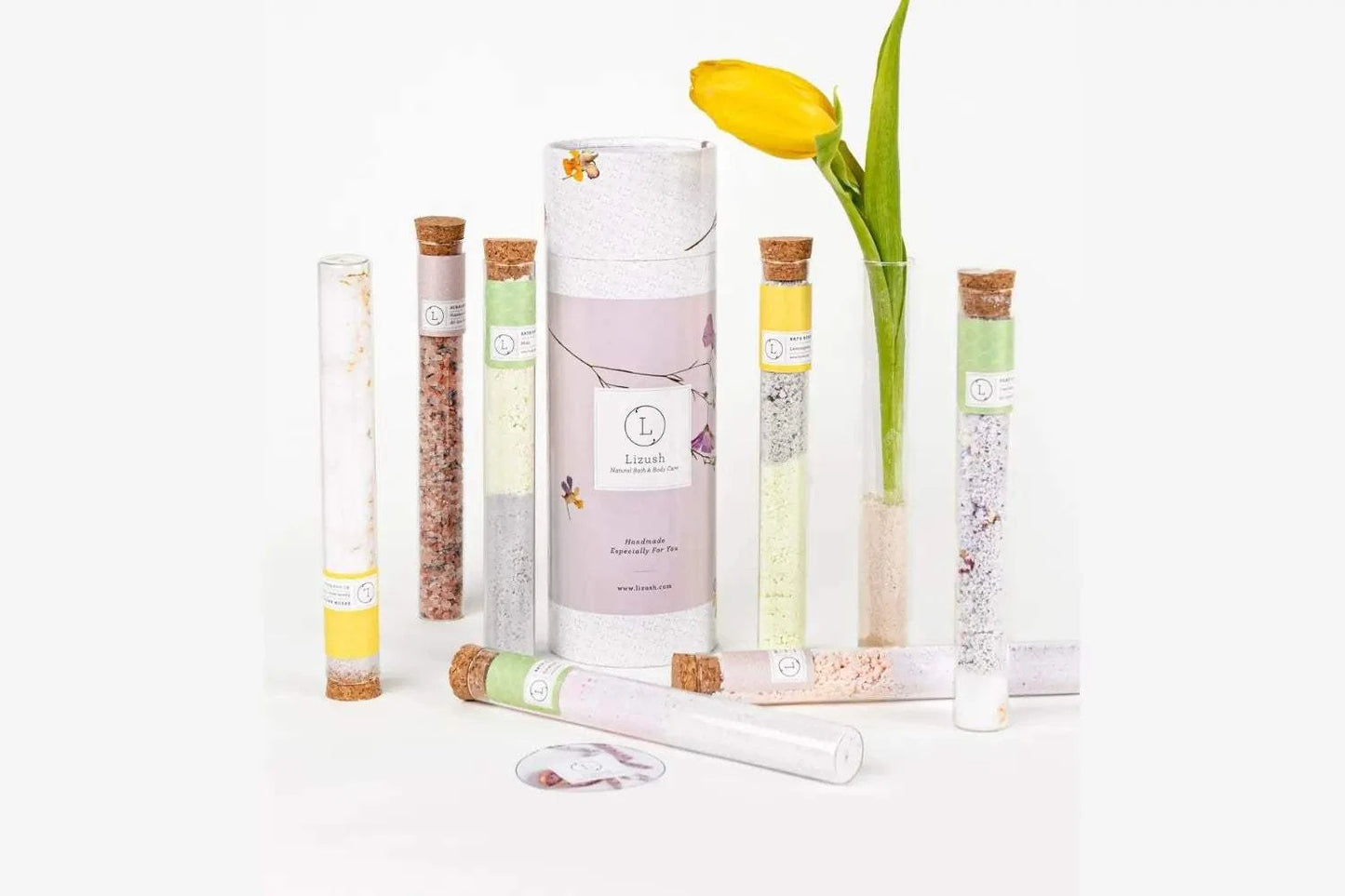 Luxurious bath salts and bombs in reused glass tubes for a premium bath experience.