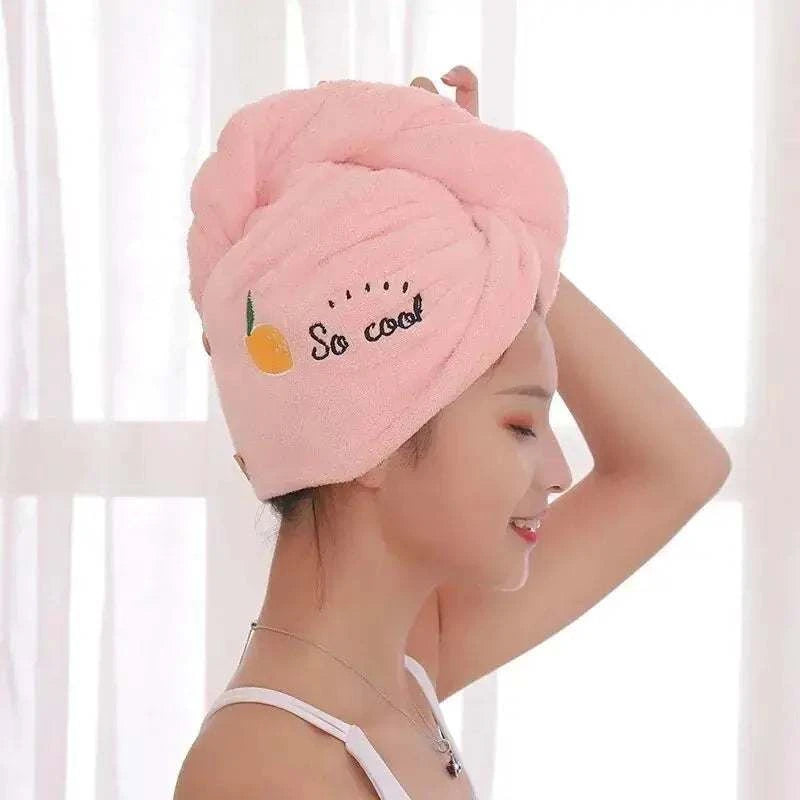 Magic Hair Towel in pink wrapped around a woman's head, featuring embroidery "So cool" with an orange design, ideal for quick drying.