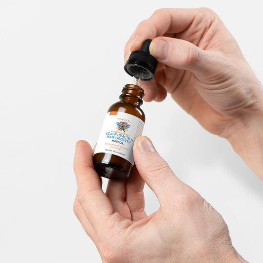 Hair Oil for Scalp Health and Hair Growth in dropper bottle.