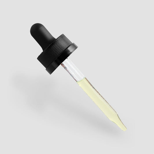 Dropper with moisturizing and strengthening hair oil essence.