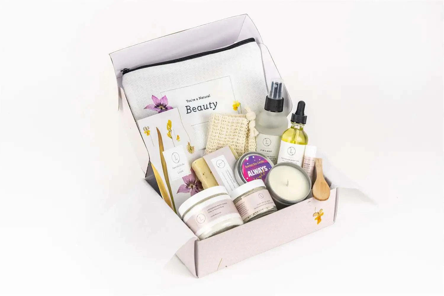 Spa Gift Box with natural lavender bath and body relaxing package, including lavender soap, body scrub, body oil, facial clay mask, scented candle, and more in a personalized box.