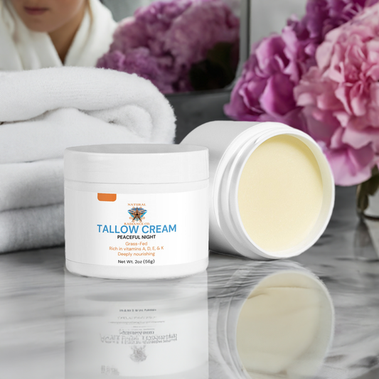 Tallow Cream Peaceful Night on a bathroom counter with pink flowers and fluffy towels in the background.