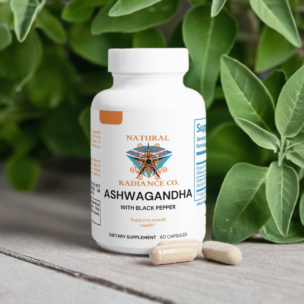 Ashwagandha supplement bottle with capsules on a wooden surface surrounded by green leaves.