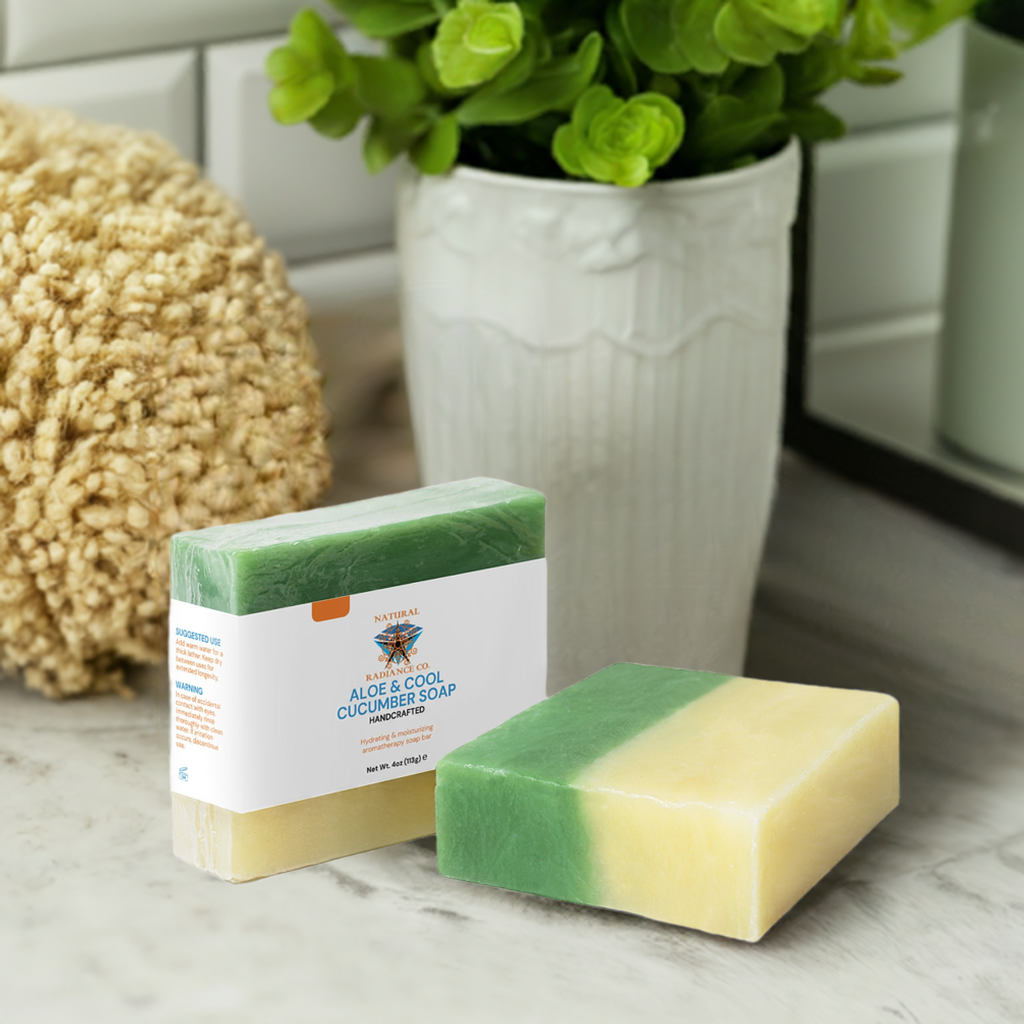 Aloe & Cool Cucumber Soap bar on a bathroom counter, surrounded by plants and a sponge, showcasing its dual-tone green and cream colors.